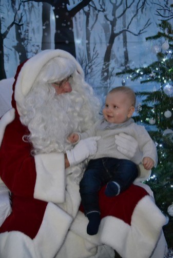 Father Christmas welcomes his first visitor